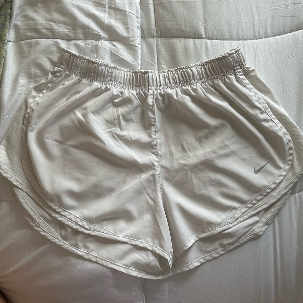 White Nike running shorts